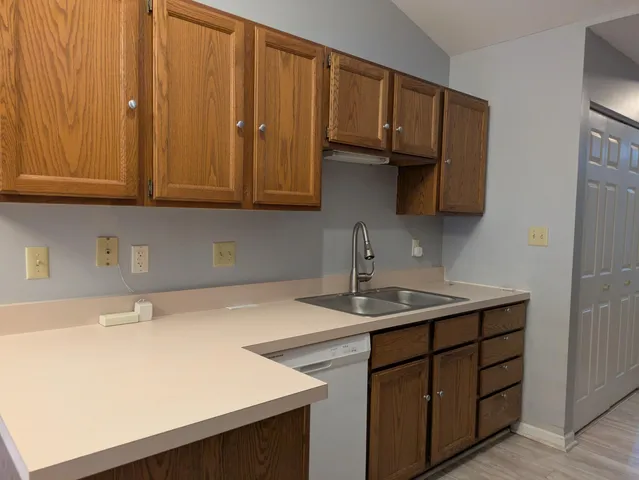 a kitchen with a sink and cabinets