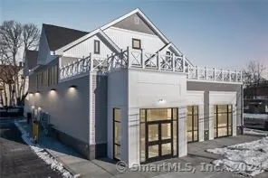 a view of a house with large windows