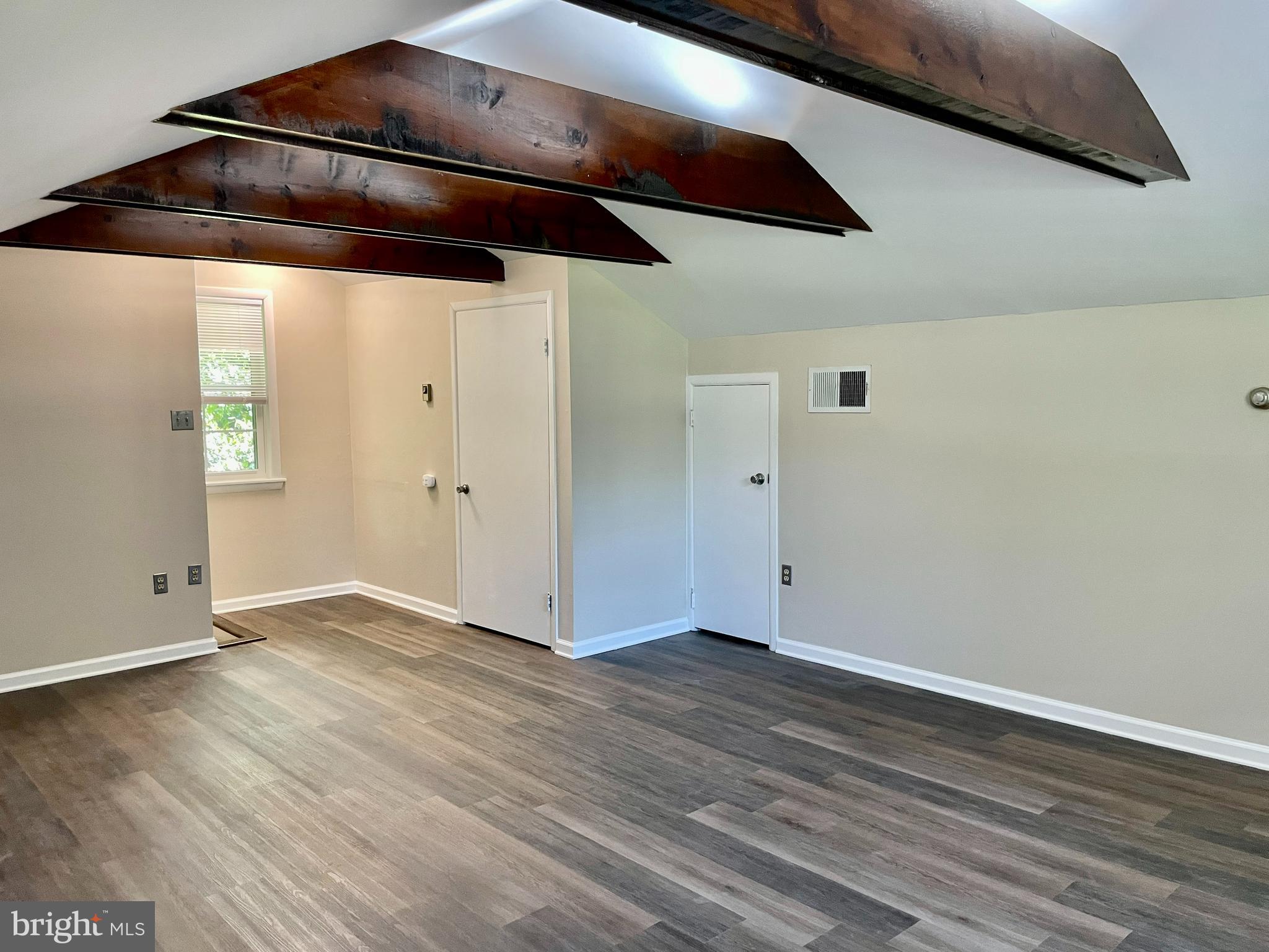 123 Oakdale Avenue Washington Crossing, PA 18977 - Photo 12 of 13 an empty room with wooden floor and windows