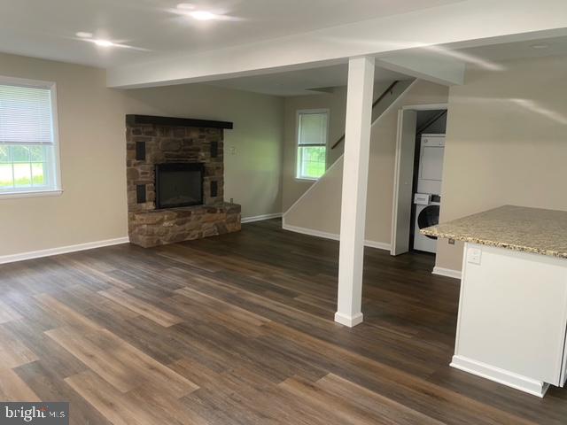 123 Oakdale Avenue Washington Crossing, PA 18977 - Photo 5 of 13 wooden floor in an empty room with a fireplace