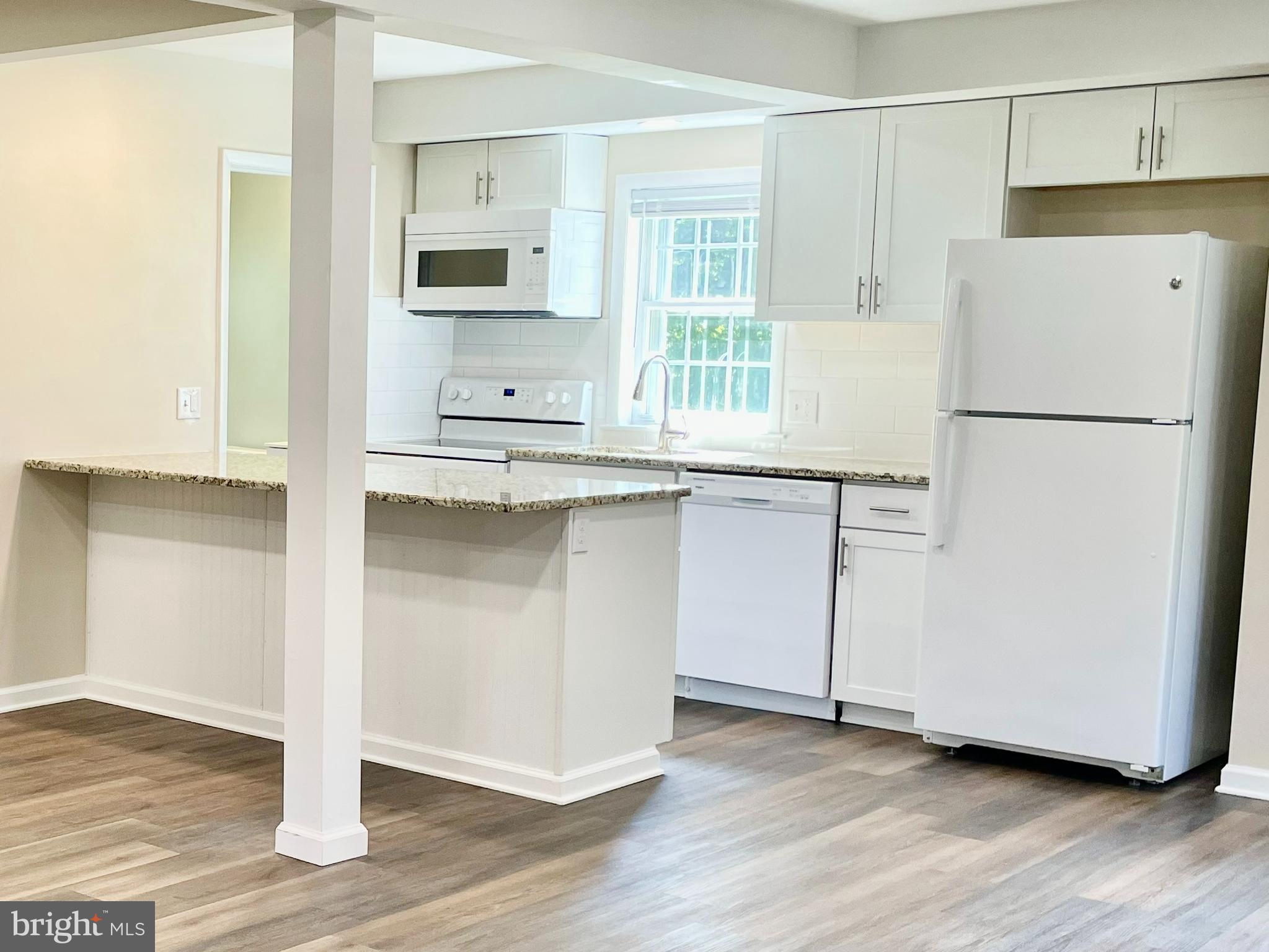 123 Oakdale Avenue Washington Crossing, PA 18977 - Photo 6 of 13 a white refrigerator freezer sitting inside of a kitchen