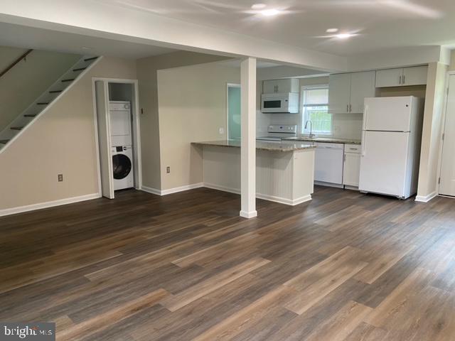 123 Oakdale Avenue Washington Crossing, PA 18977 - Photo 7 of 13 a kitchen with a refrigerator and white cabinets