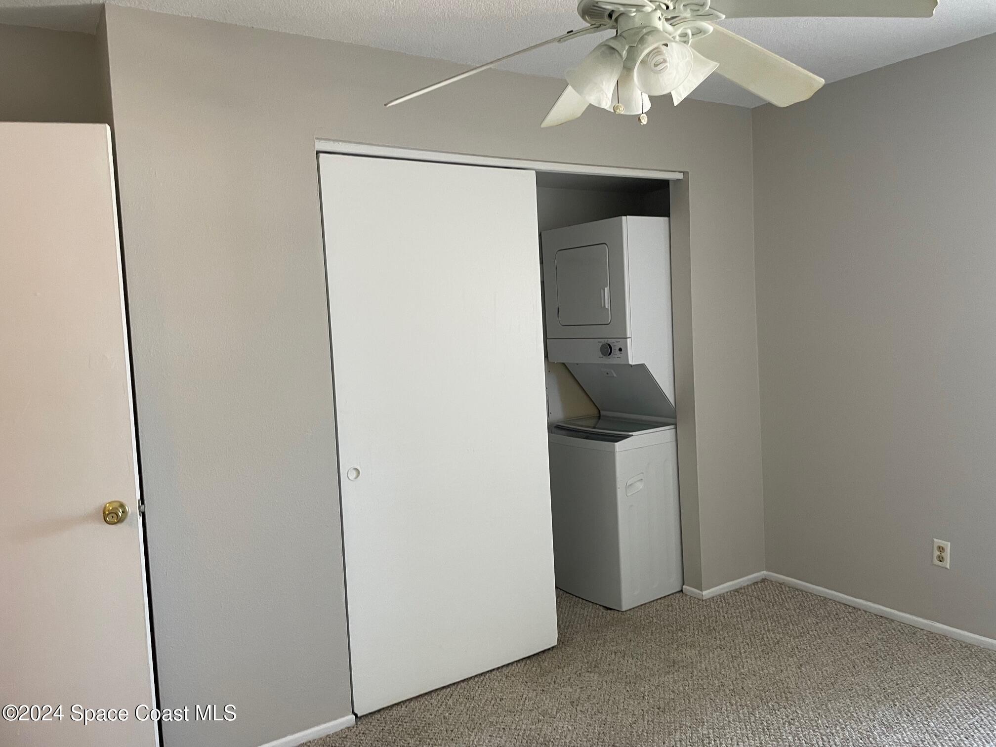 1225 North Wickham Road, Unit 415 Melbourne, FL 32935 - Photo 11 of 34 Stackable Washer/Dryer Inside The Unit