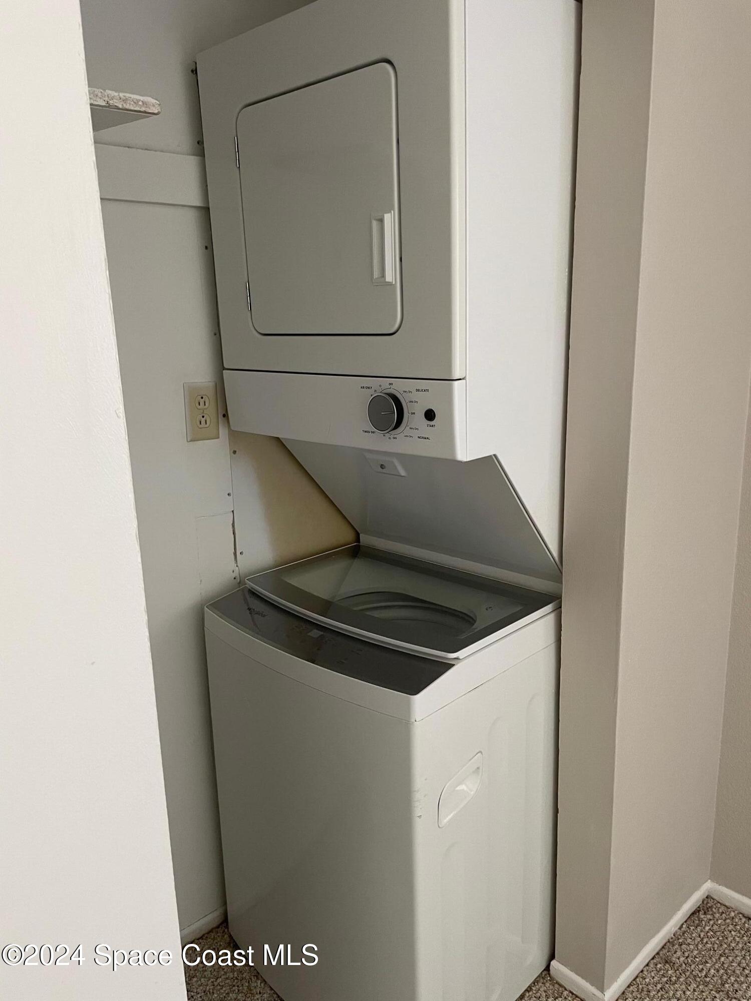 1225 North Wickham Road, Unit 415 Melbourne, FL 32935 - Photo 12 of 34 Stackable Washer/Dryer Inside the Unit
