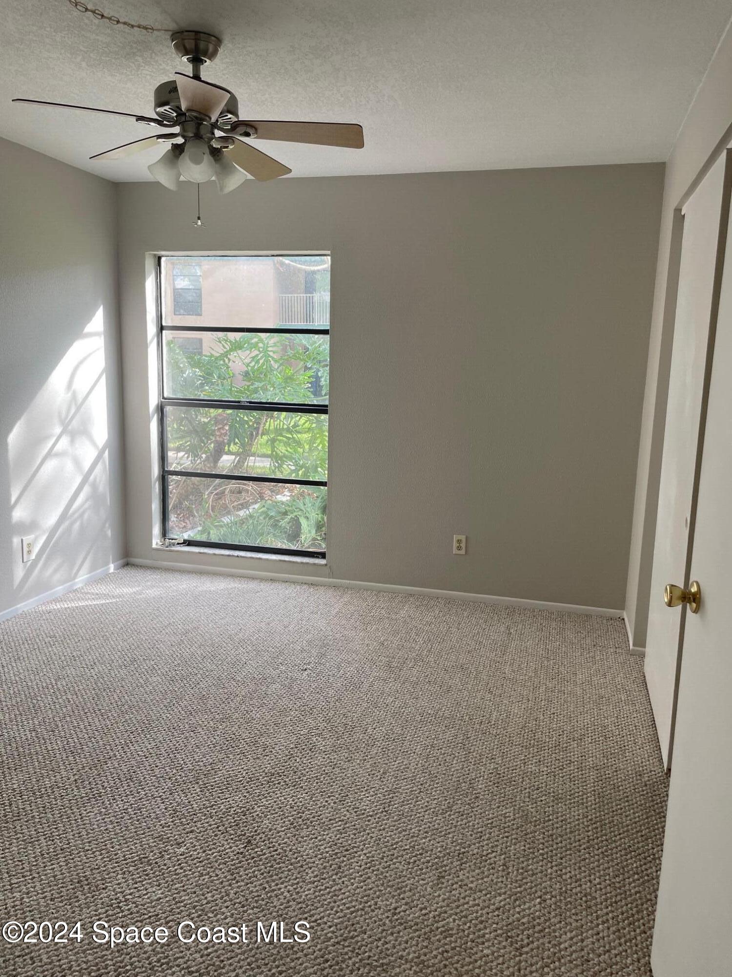 1225 North Wickham Road, Unit 415 Melbourne, FL 32935 - Photo 19 of 34 Master Bedroom