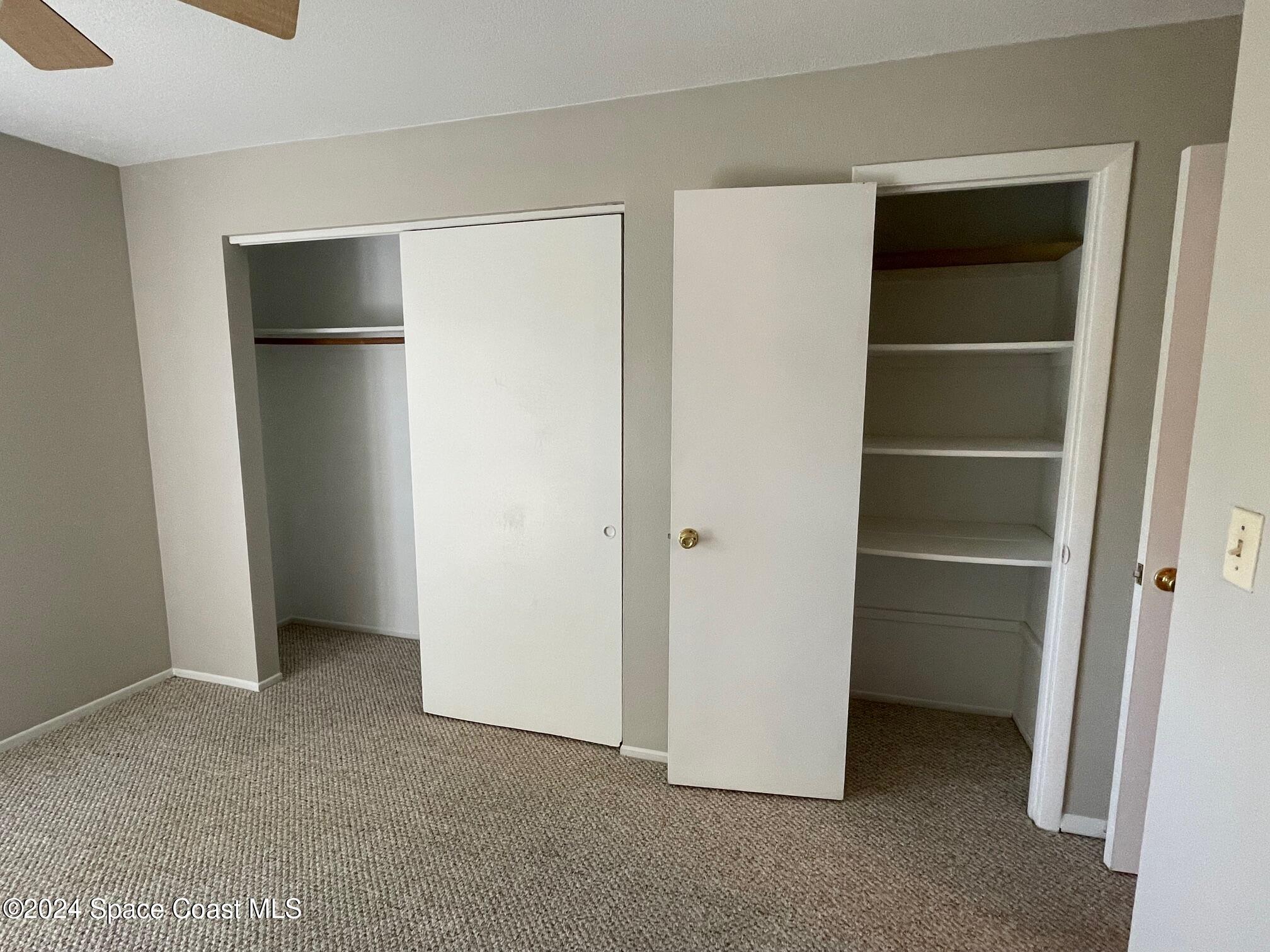 1225 North Wickham Road, Unit 415 Melbourne, FL 32935 - Photo 21 of 34 Master Bedroom Double Closet
