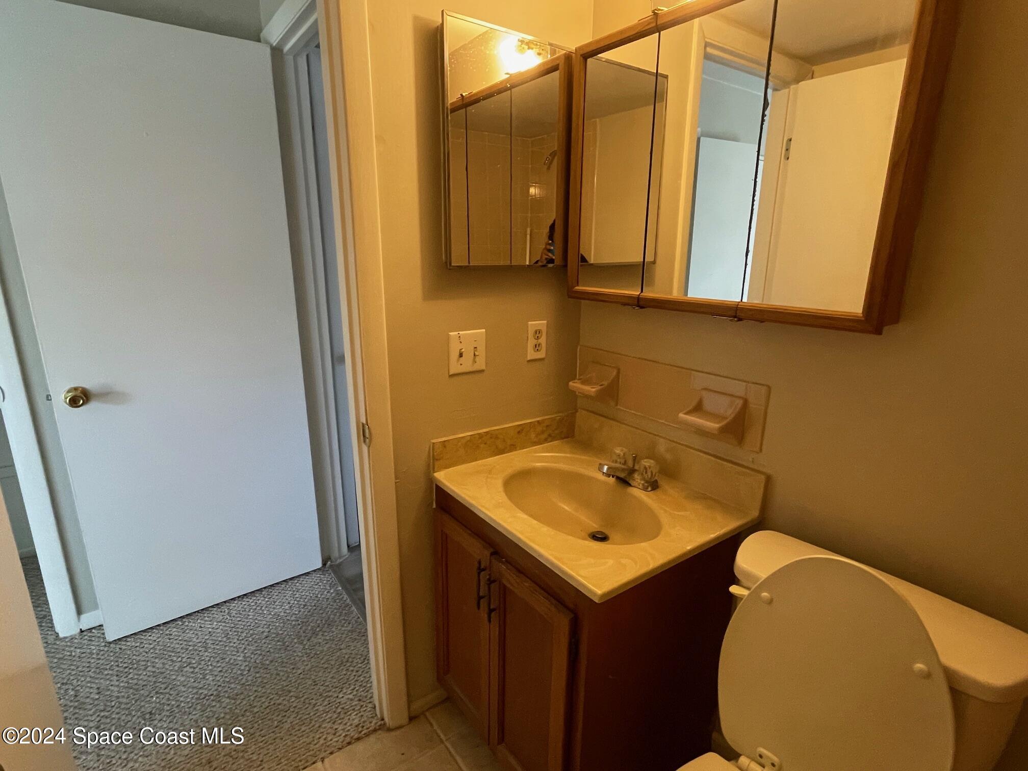 1225 North Wickham Road, Unit 415 Melbourne, FL 32935 - Photo 24 of 34 Master Bathroom. (Reflects OLD Faucet)