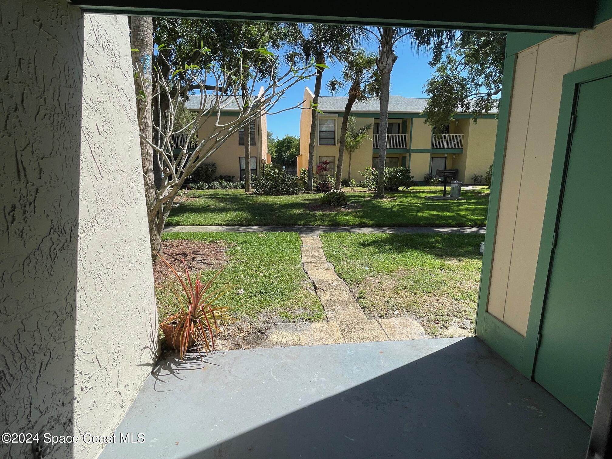 1225 North Wickham Road, Unit 415 Melbourne, FL 32935 - Photo 25 of 34 From the Back Porch