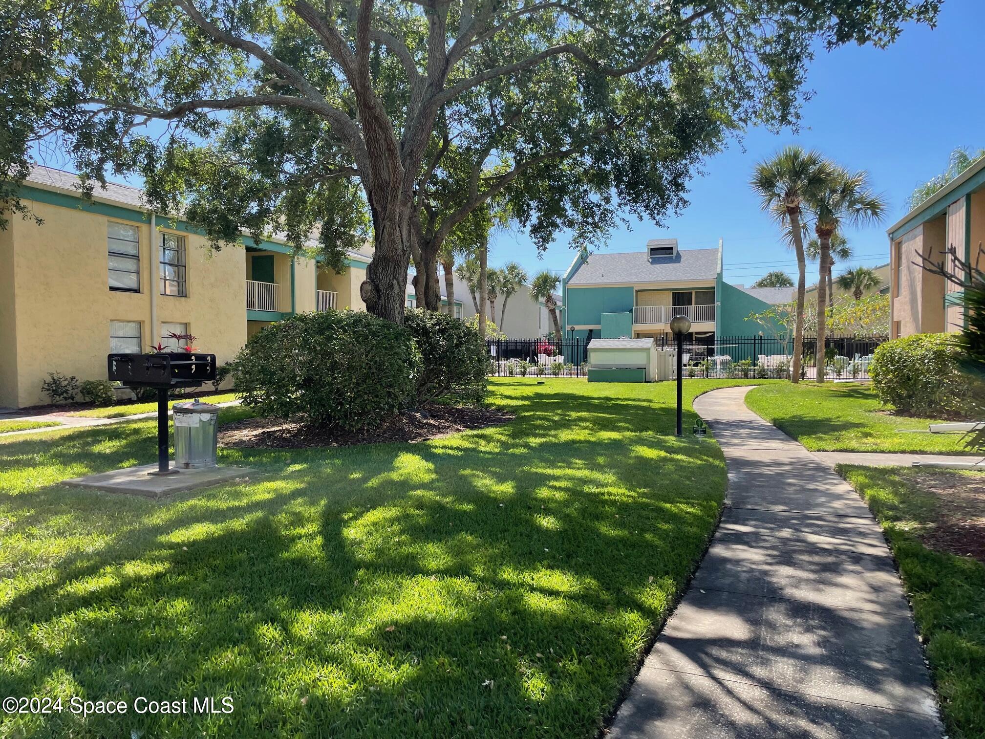 1225 North Wickham Road, Unit 415 Melbourne, FL 32935 - Photo 32 of 34 Walk to the Community Pool from Condo
