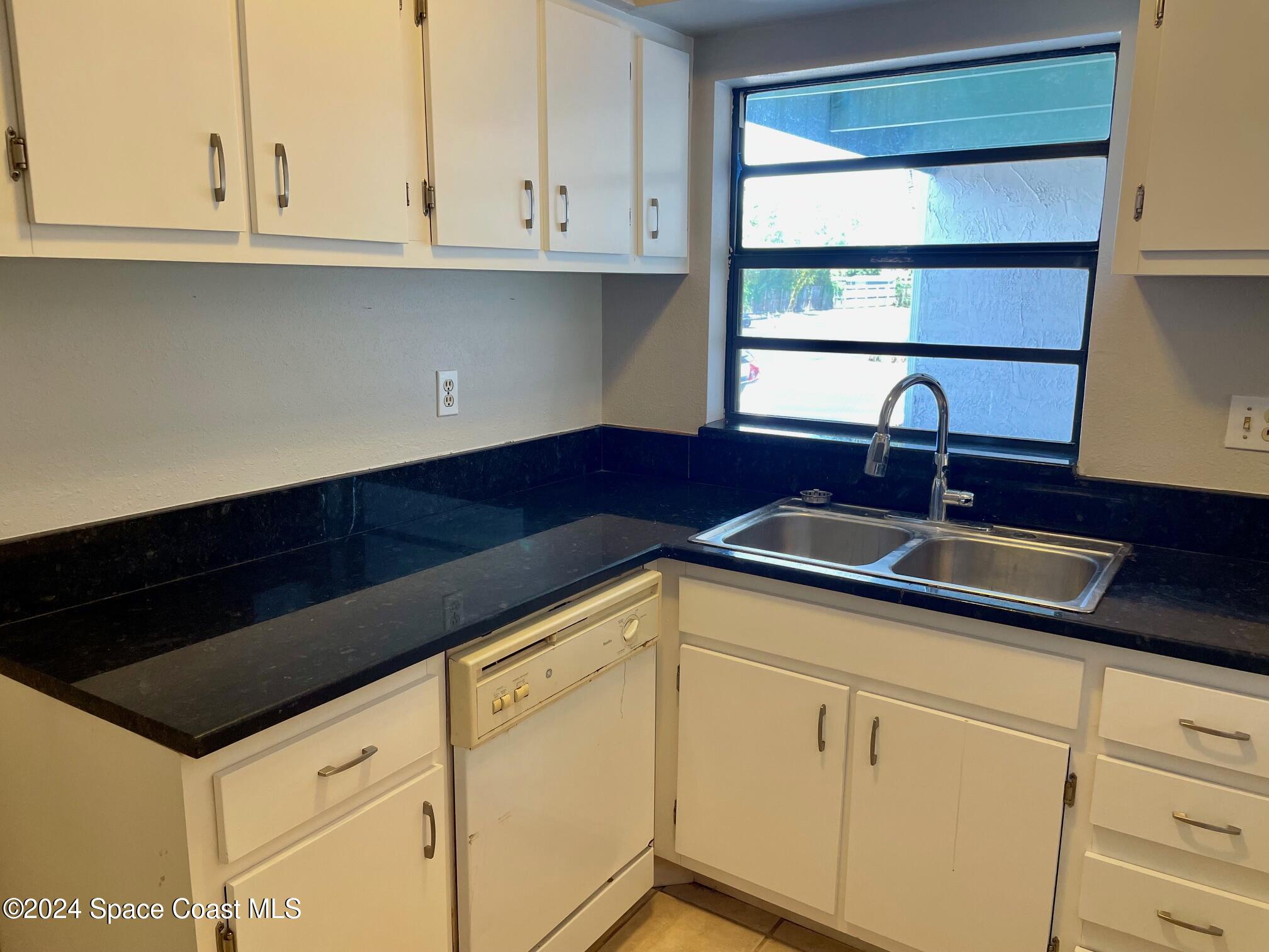 Kitchen Window. Granite Counter Top