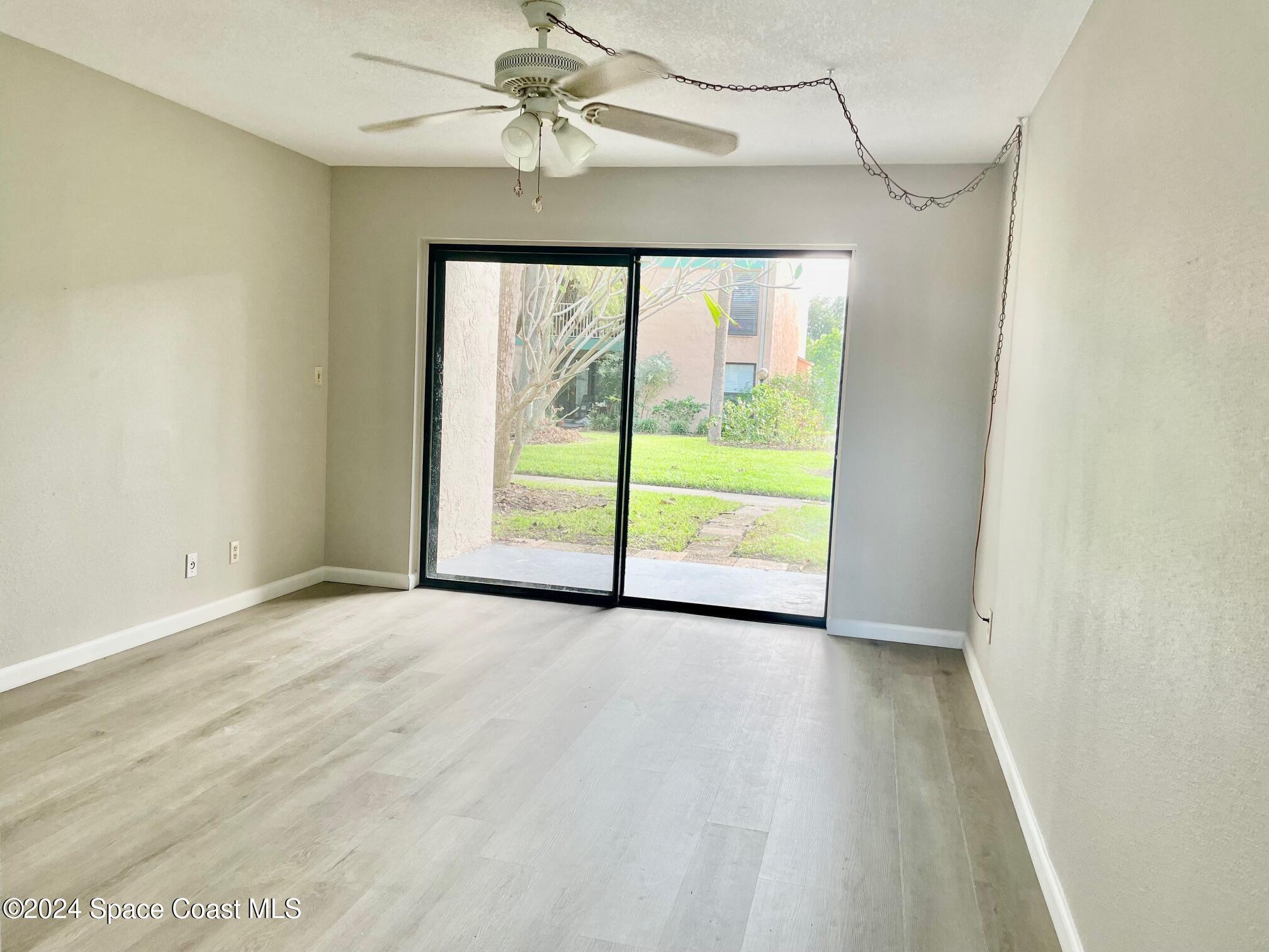 1225 North Wickham Road, Unit 415 Melbourne, FL 32935 - Photo 8 of 34 Livingroom. New Vinyl Plank Flooring