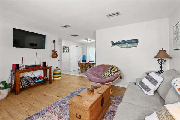 a room with furniture and a flat screen tv