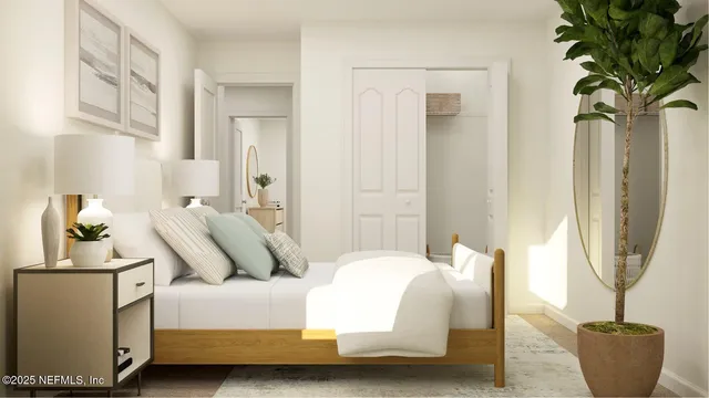 a bedroom with a large bed and a window