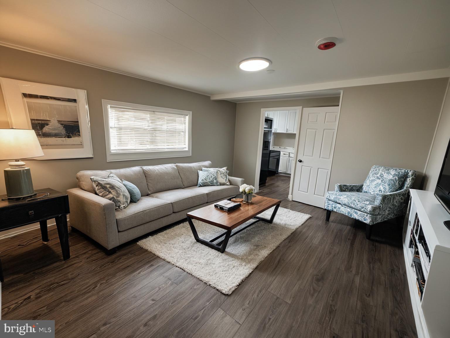 4328 Ridge Road, Unit 1A Mount Airy, MD 21771 - Photo 3 of 12 a living room with furniture and wooden floor