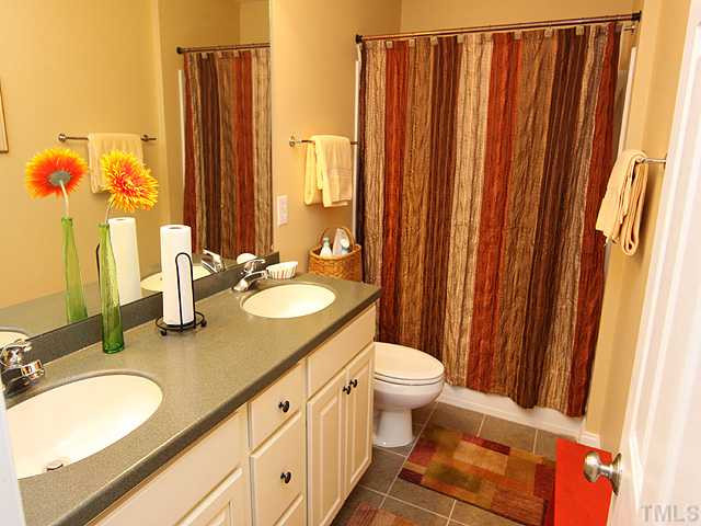 2500 Happy Lane Raleigh, NC 27614 - Photo 11 of 23 Secondary bedroom bath has tile floor and solid surface countertops. Bathroom