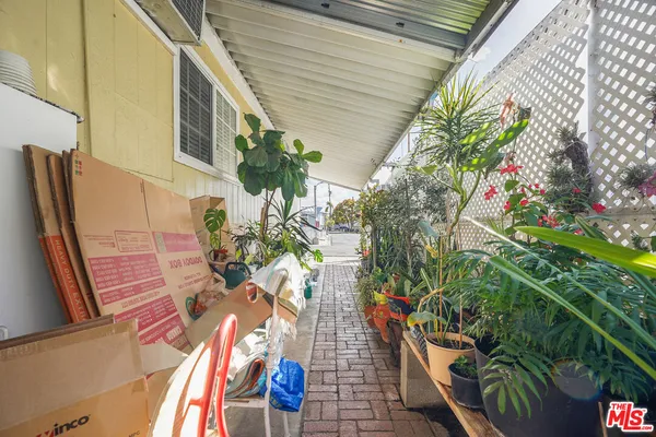 a backyard of a house with outdoor seating