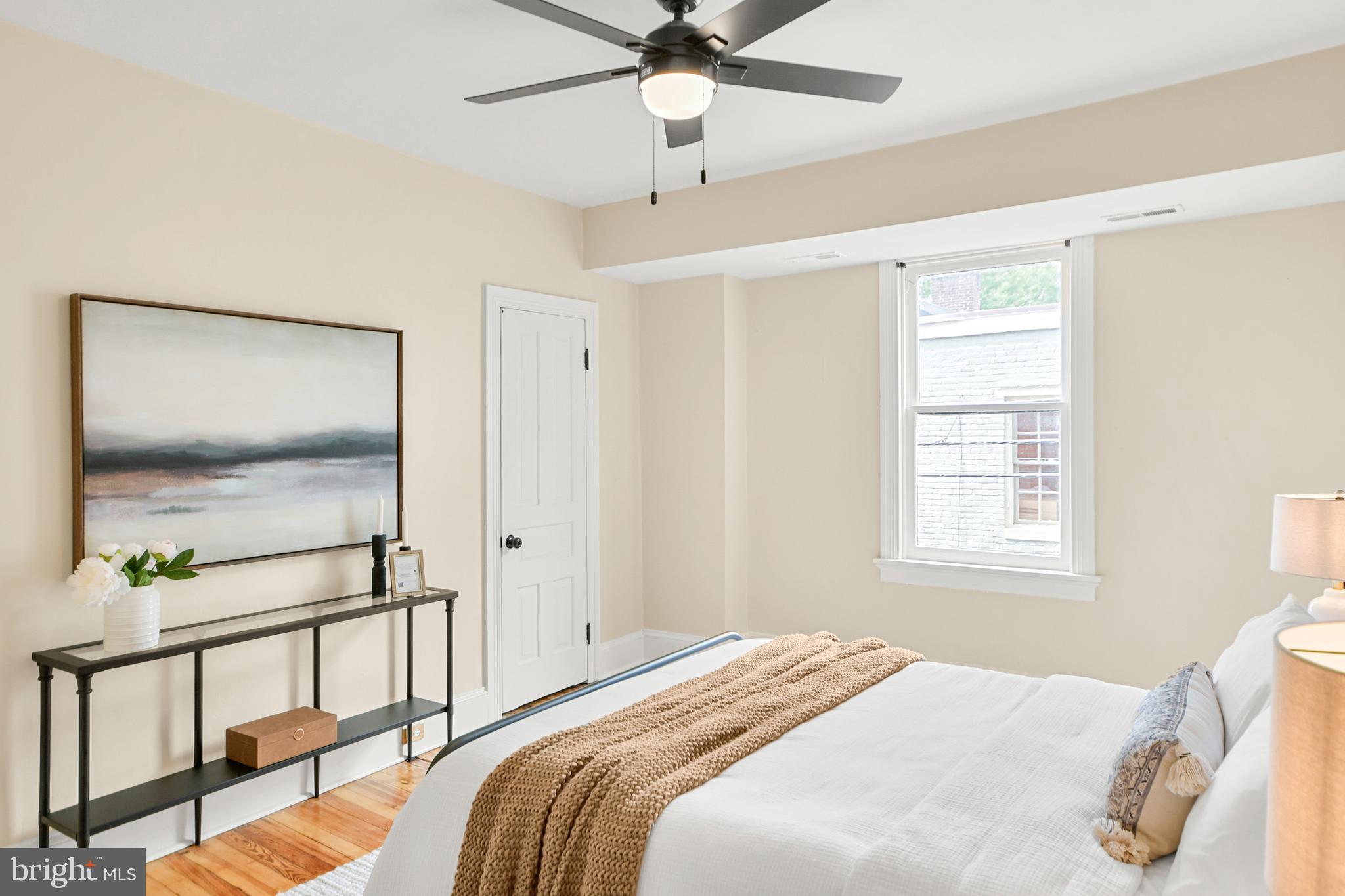 23 West 4th Street Frederick, MD 21701 - Photo 17 of 105 a bedroom with a bed a chandelier and a window
