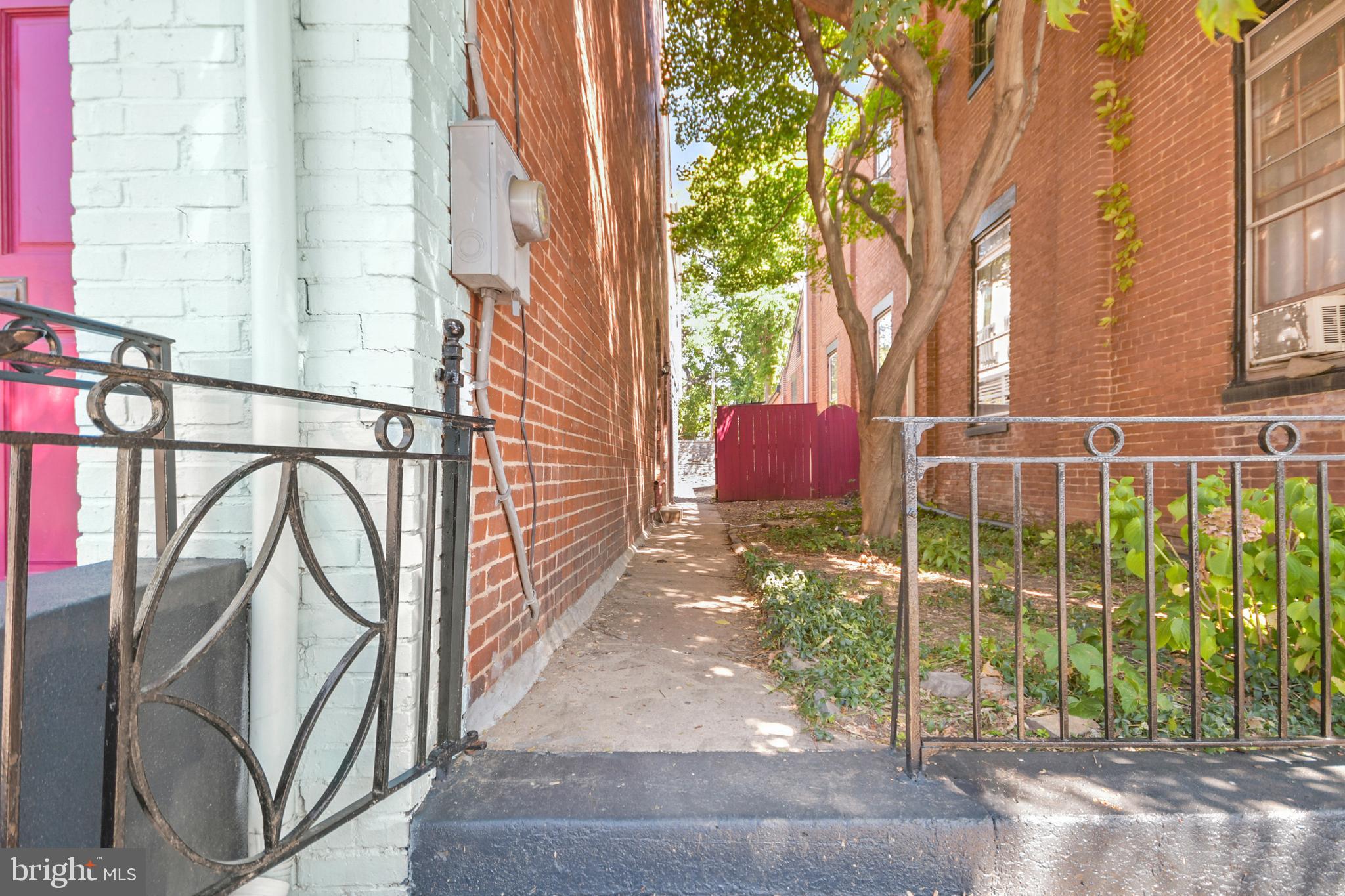 23 West 4th Street Frederick, MD 21701 - Photo 52 of 105 a view of a house with a floor to ceiling window and wooden fence