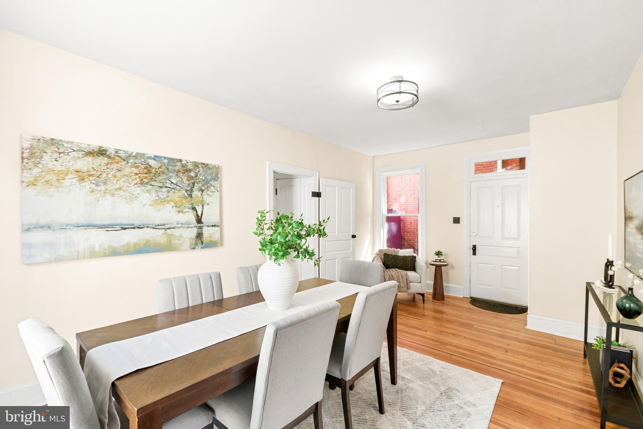 23 West 4th Street Frederick, MD 21701 - Photo 7 of 105 a view of a dining room with furniture window and wooden floor