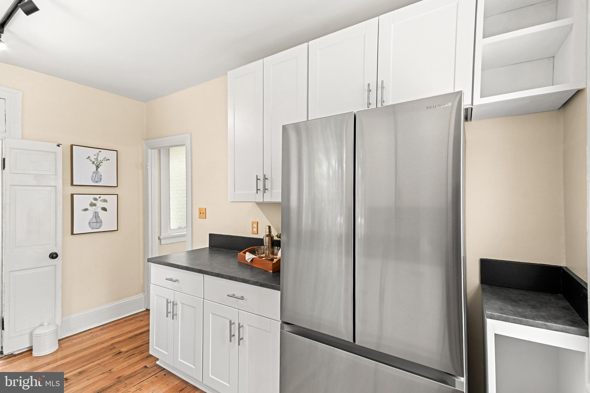 23 West 4th Street Frederick, MD 21701 - Photo 73 of 105 a kitchen with stainless steel appliances a refrigerator and a stove top oven