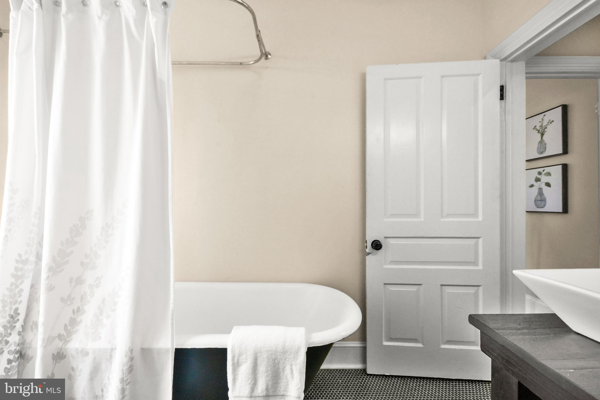 23 West 4th Street Frederick, MD 21701 - Photo 78 of 105 a bathroom with a sink and a bath tub