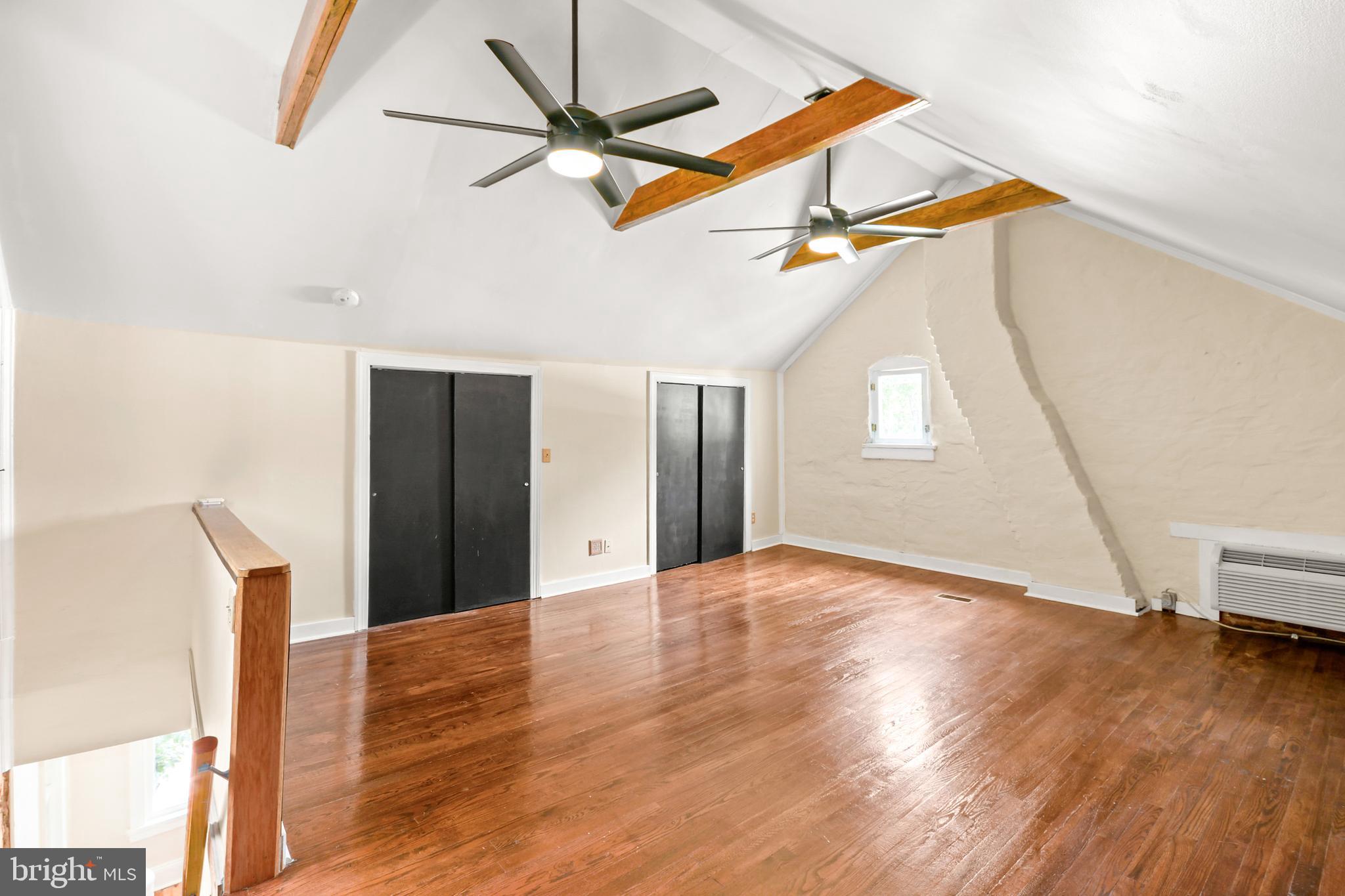 23 West 4th Street Frederick, MD 21701 - Photo 82 of 105 a view of an empty room with wooden floor and a window