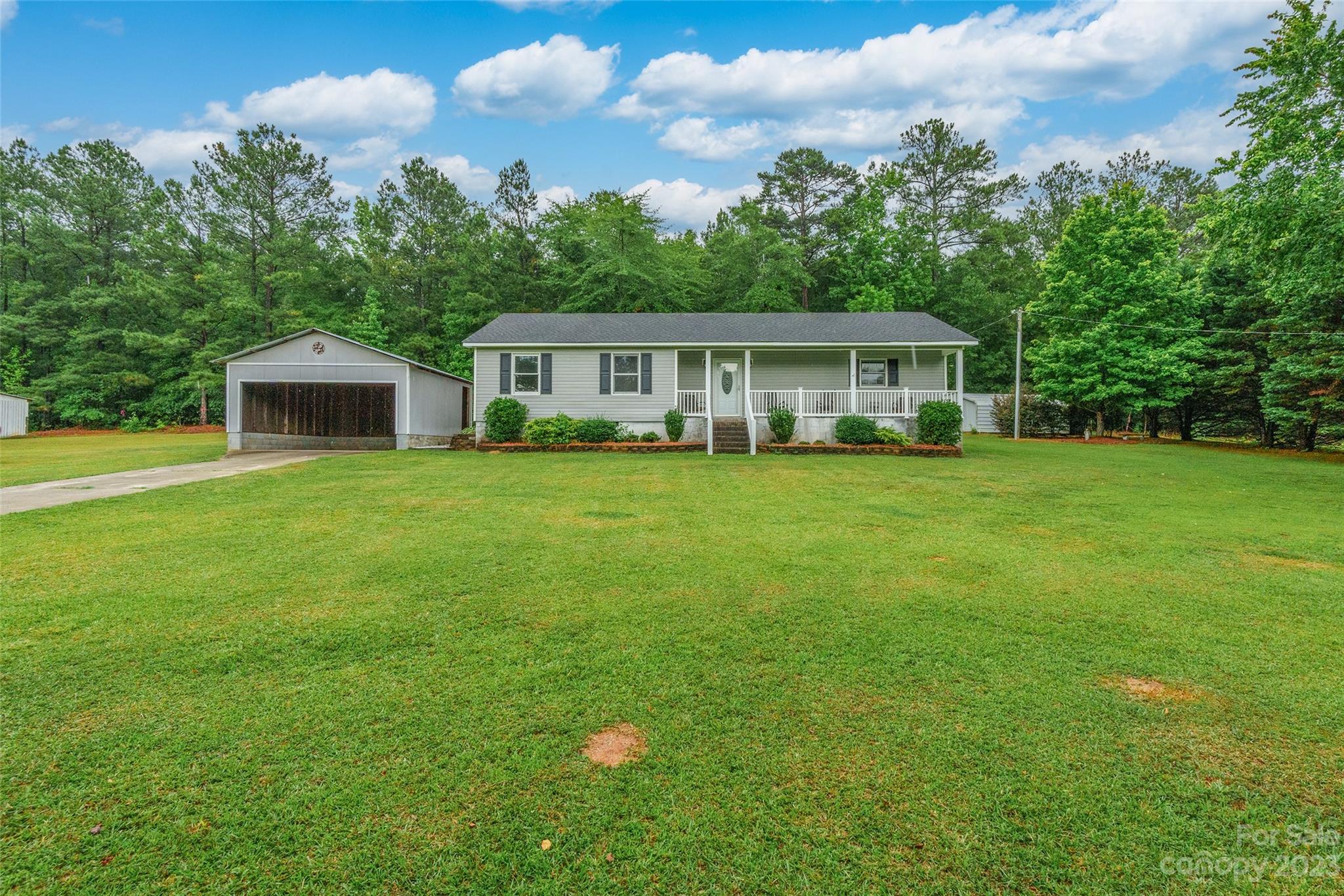 74 Joe Miller Road Jefferson, SC 29718 - Photo 1 of 29 a front view of a house with a garden