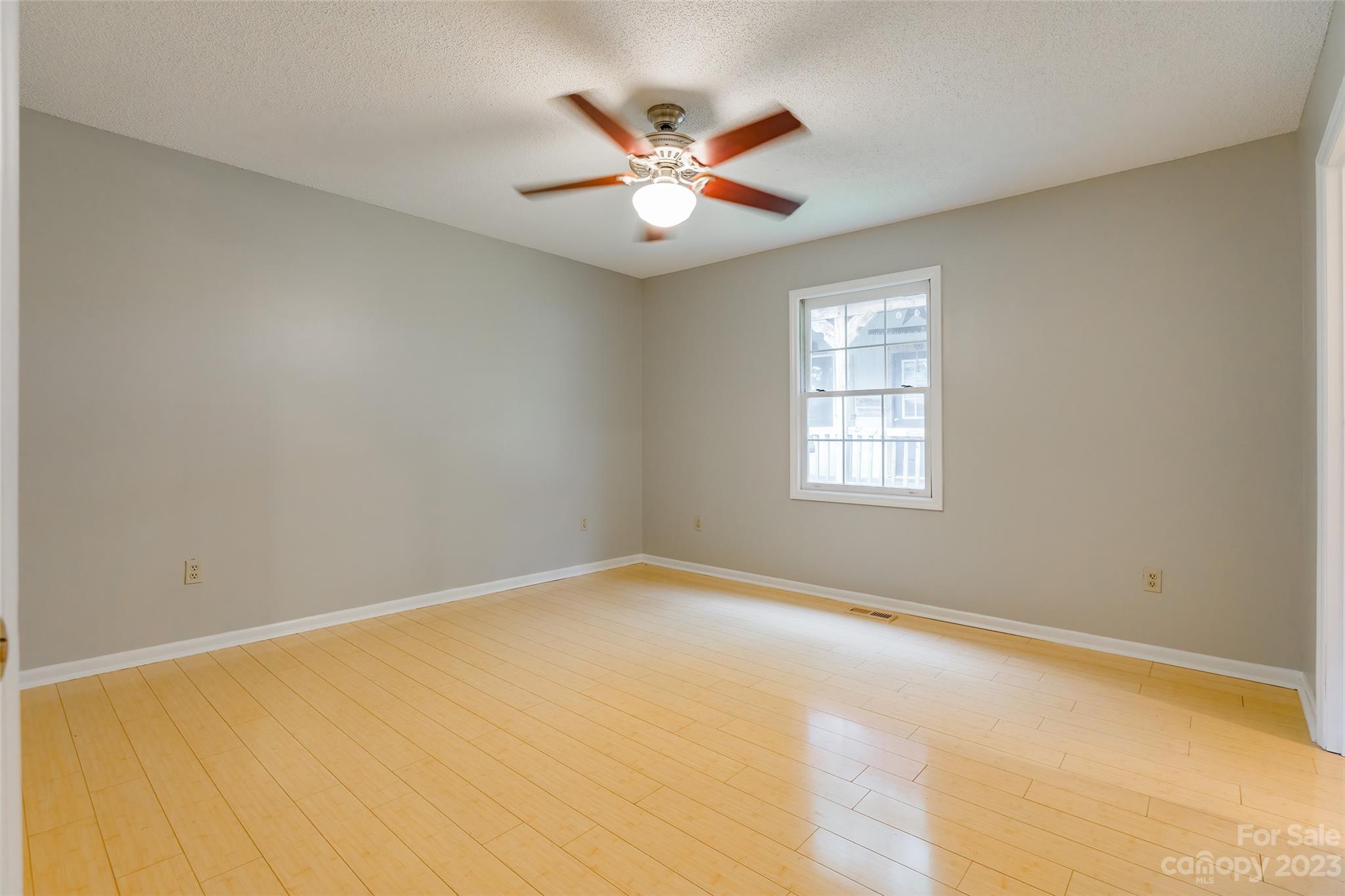 74 Joe Miller Road Jefferson, SC 29718 - Photo 12 of 29 an empty room with window and ceiling fan