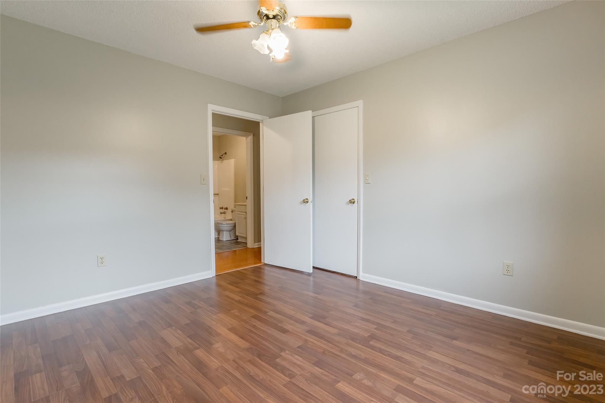 74 Joe Miller Road Jefferson, SC 29718 - Photo 18 of 29 a view of an empty room with wooden floor