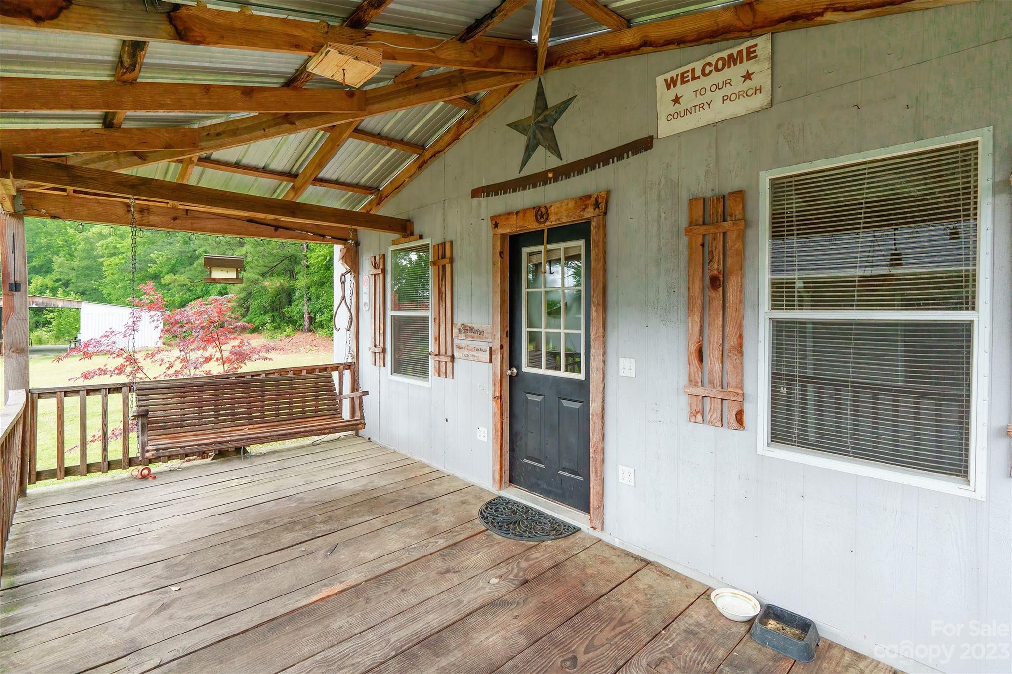 74 Joe Miller Road Jefferson, SC 29718 - Photo 24 of 29 a outdoor space with porch and furniture