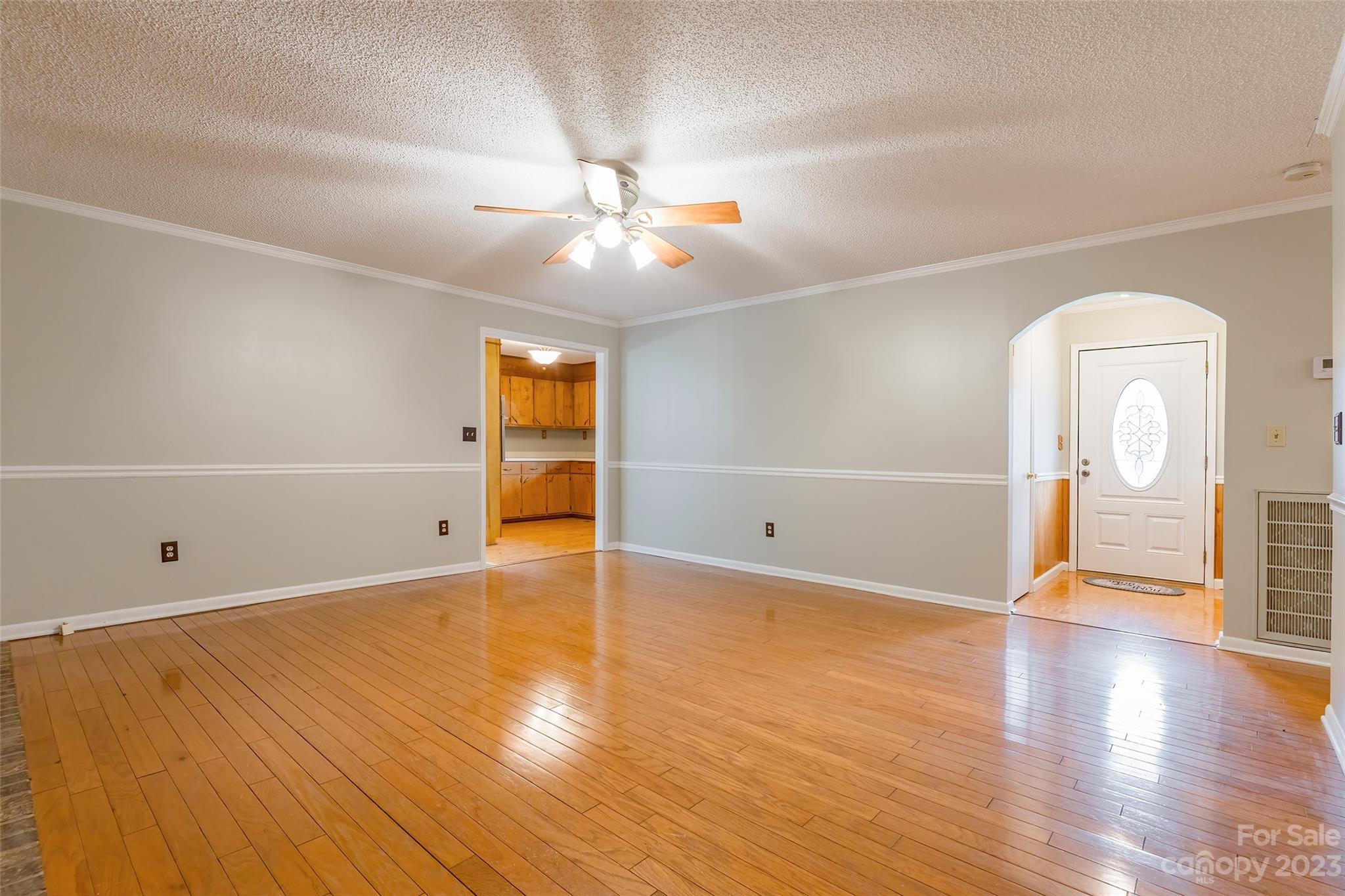 74 Joe Miller Road Jefferson, SC 29718 - Photo 7 of 29 wooden floor in an empty room with a window