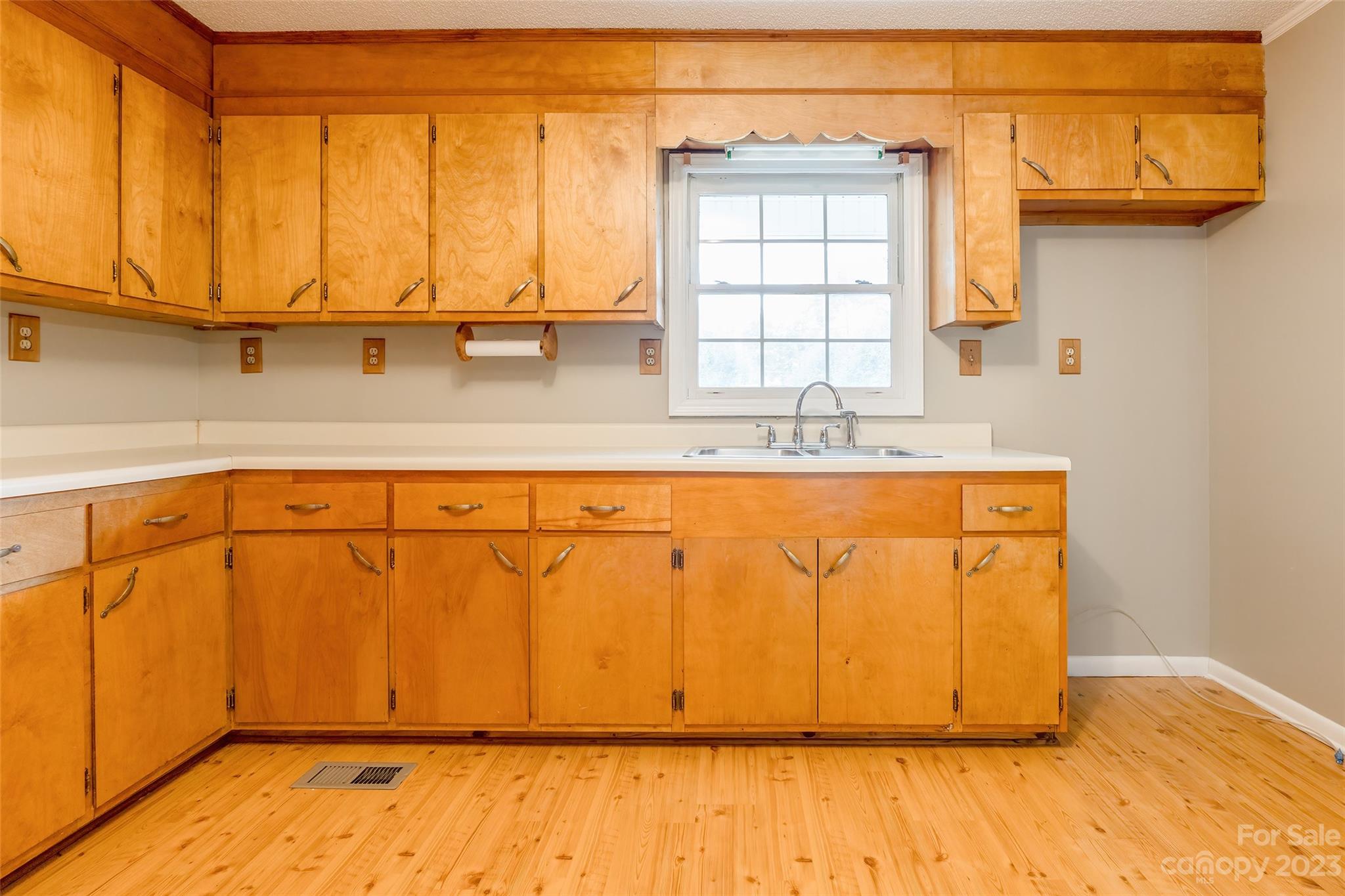 74 Joe Miller Road Jefferson, SC 29718 - Photo 9 of 29 a view of a kitchen with wooden floor and a window