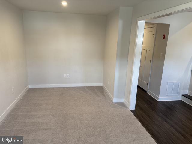 711 Quarry Point Road Malvern, PA 19355 - Photo 24 of 26 an empty room with wooden floor and a window