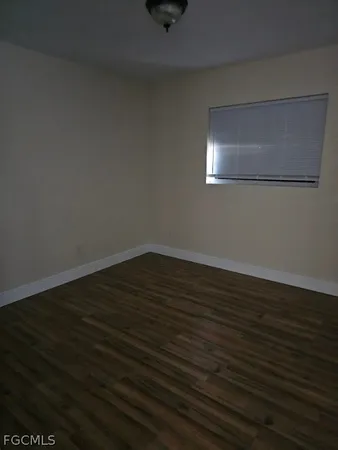 a view of a hallway with wooden walls and stairs