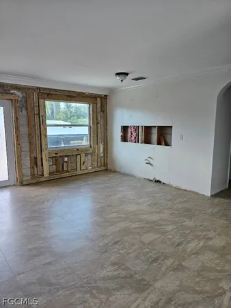 a view of an empty room with a window