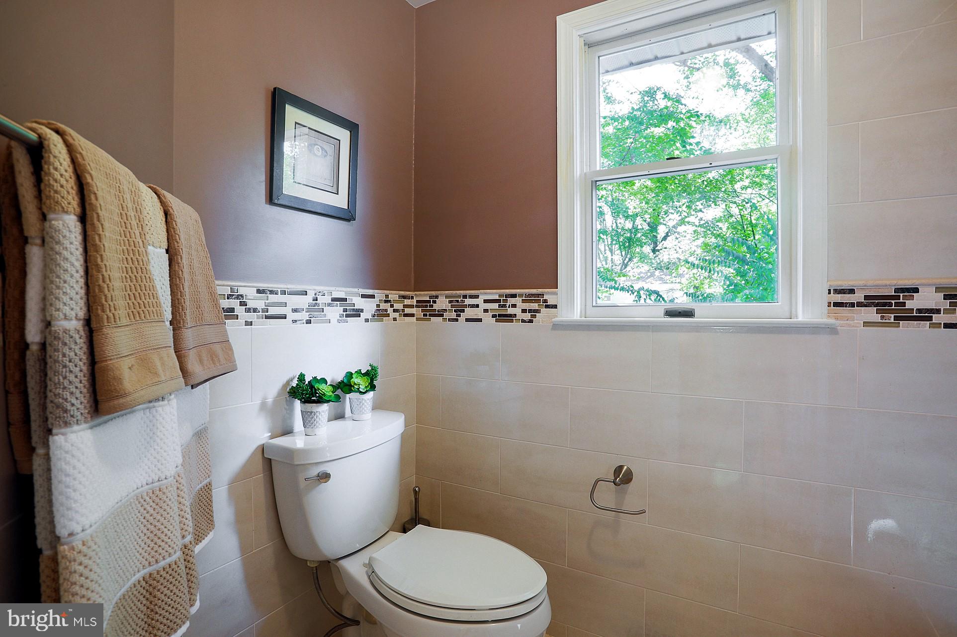 2219 Clark Place Silver Spring, MD 20902 - Photo 32 of 72 MASTER TUB & TOILET AREA WITH SPARKLING TILE