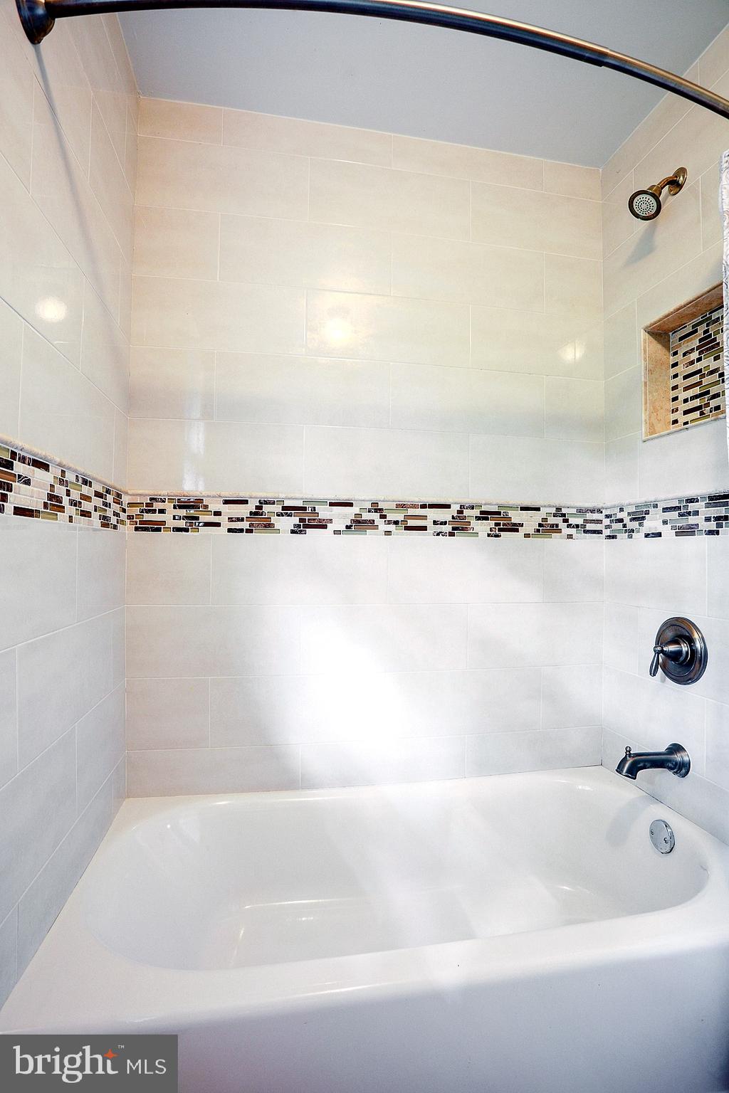 2219 Clark Place Silver Spring, MD 20902 - Photo 33 of 72 VIEW OF TUB SHOWER ENCLOSURE WITH WALL NICHE
