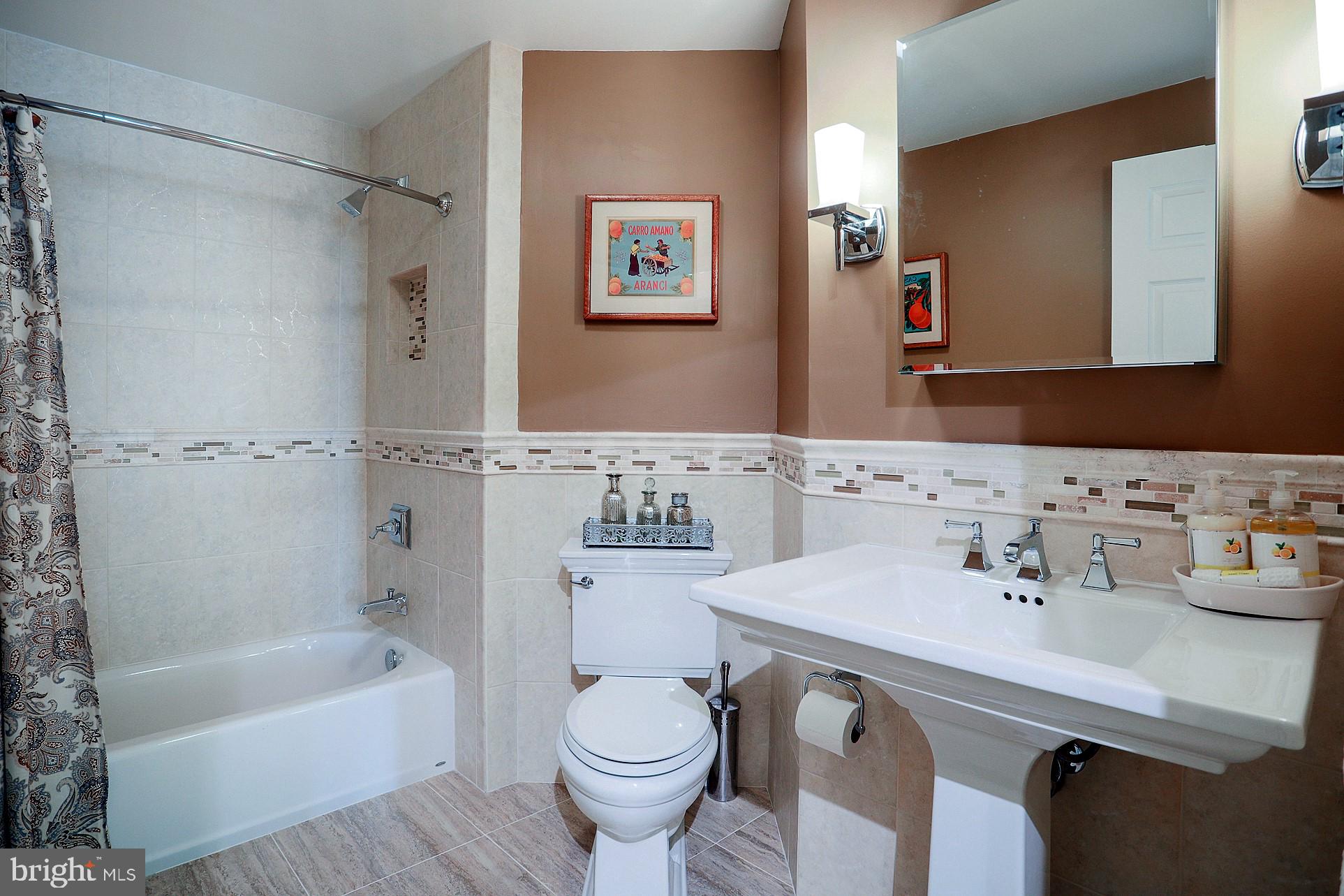 2219 Clark Place Silver Spring, MD 20902 - Photo 37 of 72 HALL BATH HAS BEEN RENOVATED WITH STUNNING TILE