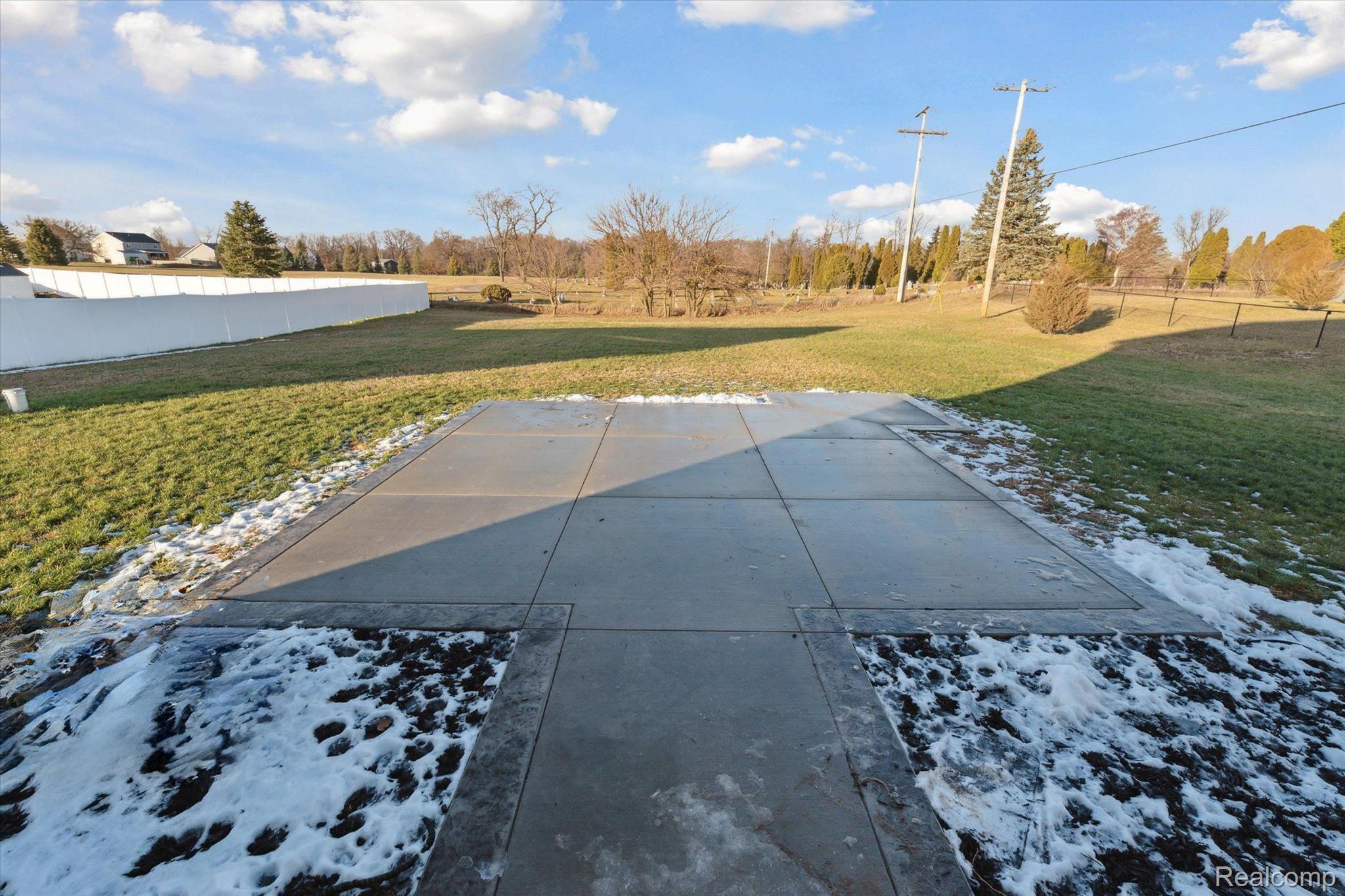 8024 Jordan Drive Jackson, MI 49201 - Photo 36 of 39 Custom concrete patio with stamped concrete edge