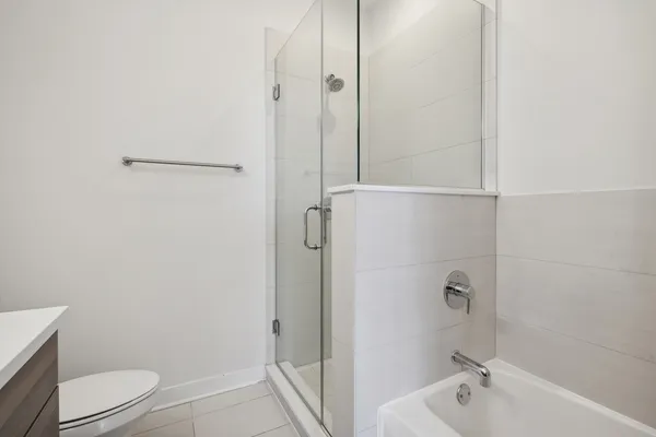 a bathroom with a shower and a toilet