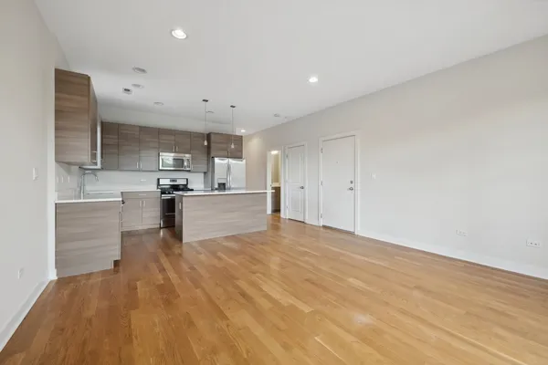 a view of kitchen with wooden floor