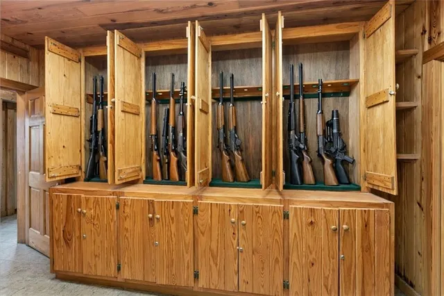 a bathroom with a granite countertop toilet sink and mirror