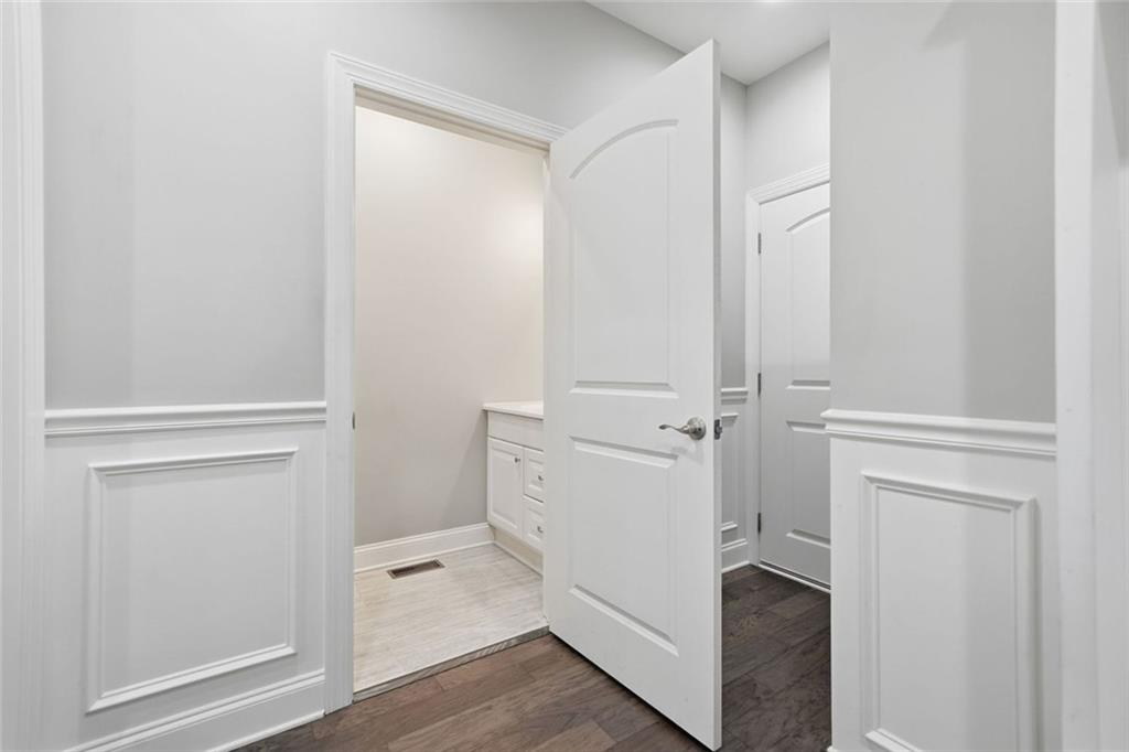 1006 Owens Store Road Canton, GA 30115 - Photo 17 of 48 a view of walk in closet with hardwood
