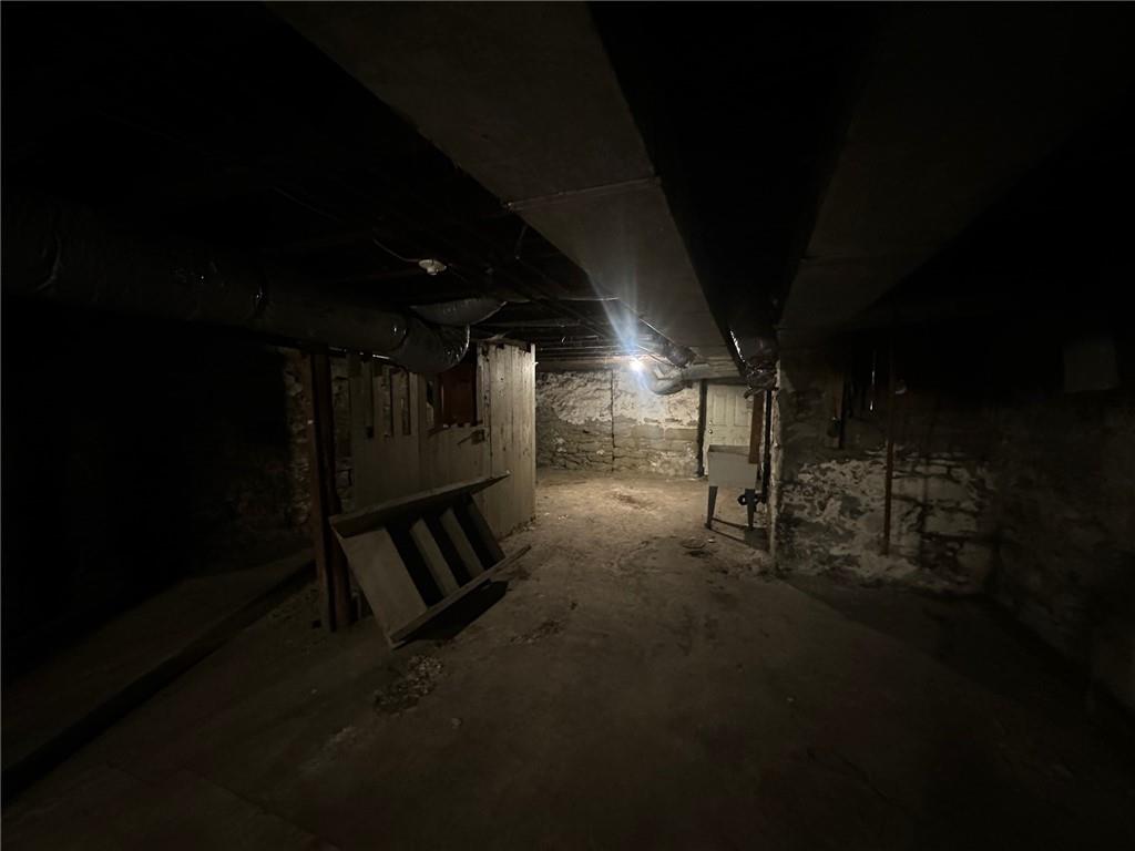 702 Whitney Avenue Pittsburgh, PA 15221 - Photo 13 of 39 a view of an empty room with wooden floor