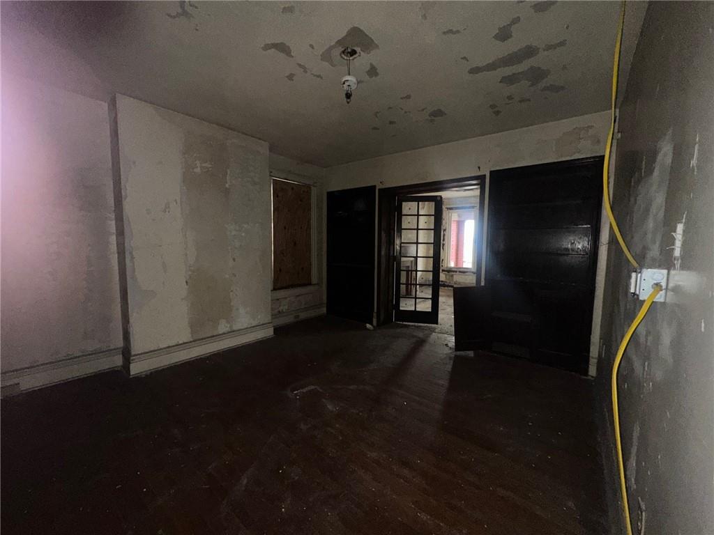 702 Whitney Avenue Pittsburgh, PA 15221 - Photo 20 of 39 wooden floor in an empty room