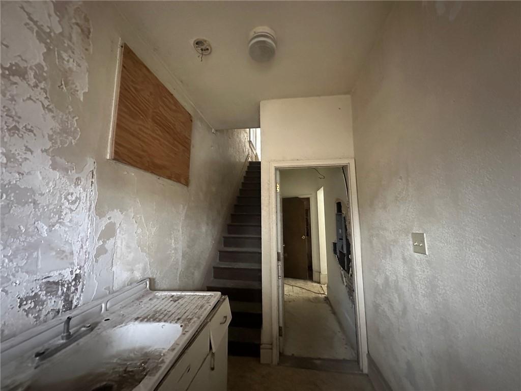 702 Whitney Avenue Pittsburgh, PA 15221 - Photo 3 of 39 a bathroom with a sink and mirror