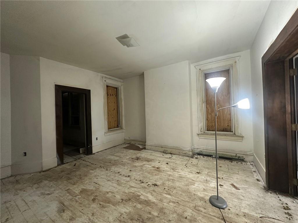 702 Whitney Avenue Pittsburgh, PA 15221 - Photo 5 of 39 a view of a livingroom with a chair