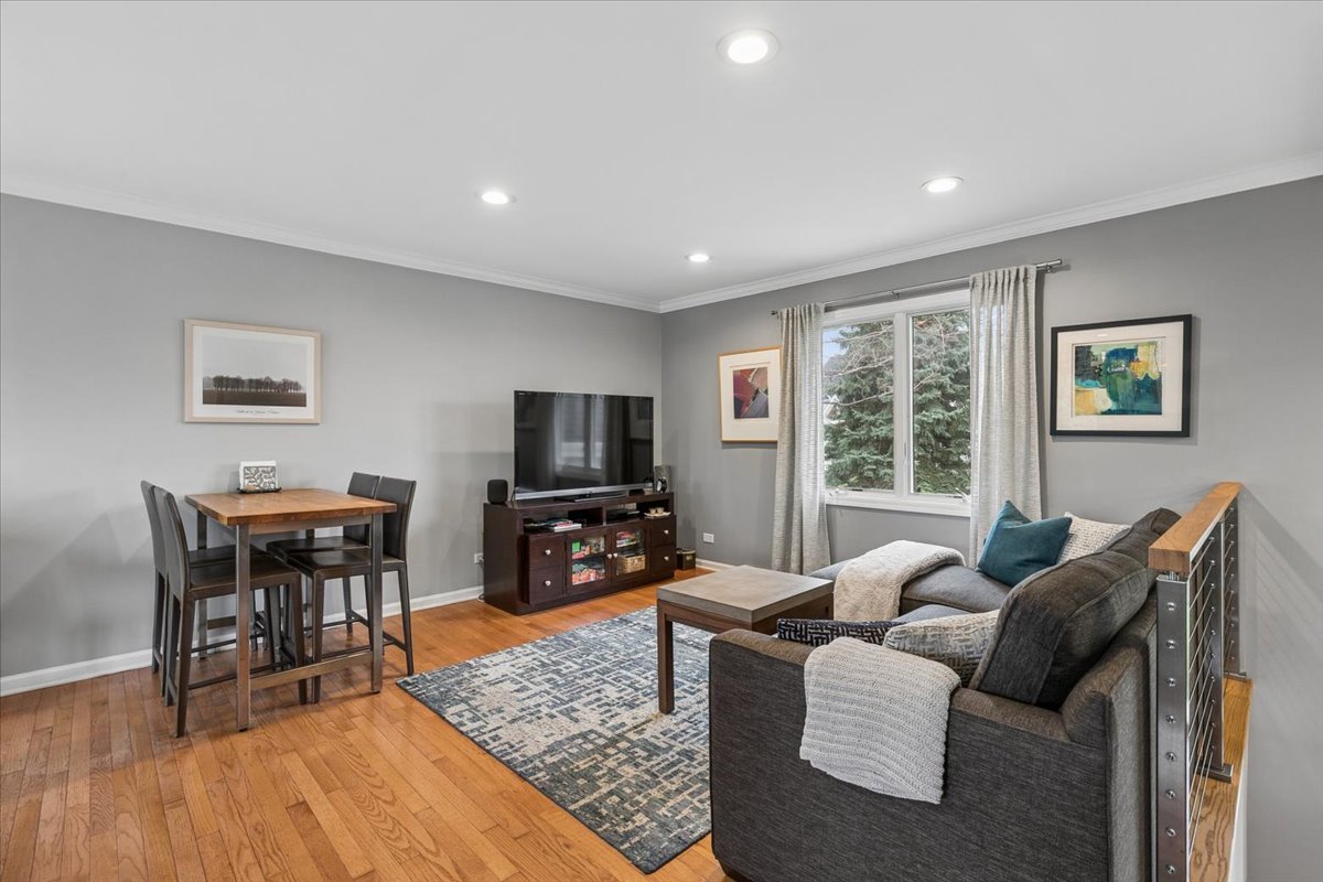 904 West Woodland Road Lake Bluff, IL 60044 - Photo 11 of 28 a living room with furniture a flat screen tv and wooden floor