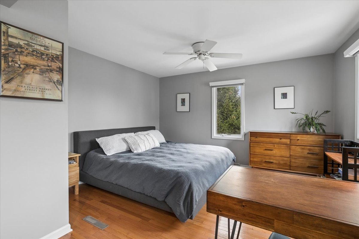 904 West Woodland Road Lake Bluff, IL 60044 - Photo 12 of 28 a bedroom with a bed and a dresser