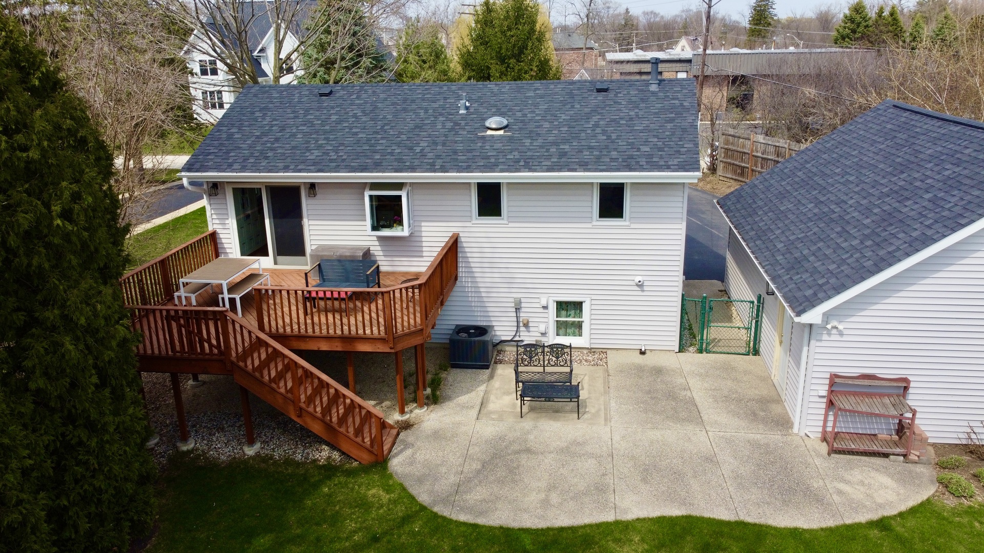 904 West Woodland Road Lake Bluff, IL 60044 - Photo 24 of 28 a view of a house with backyard porch and sitting area